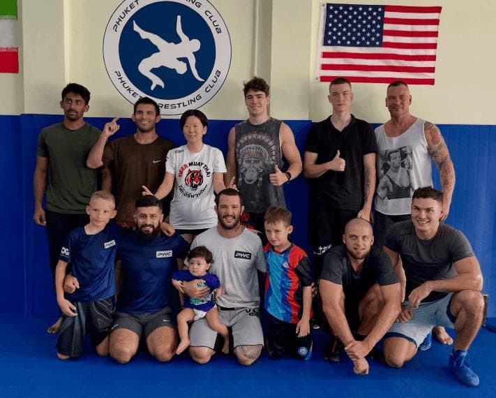 Gym members training together